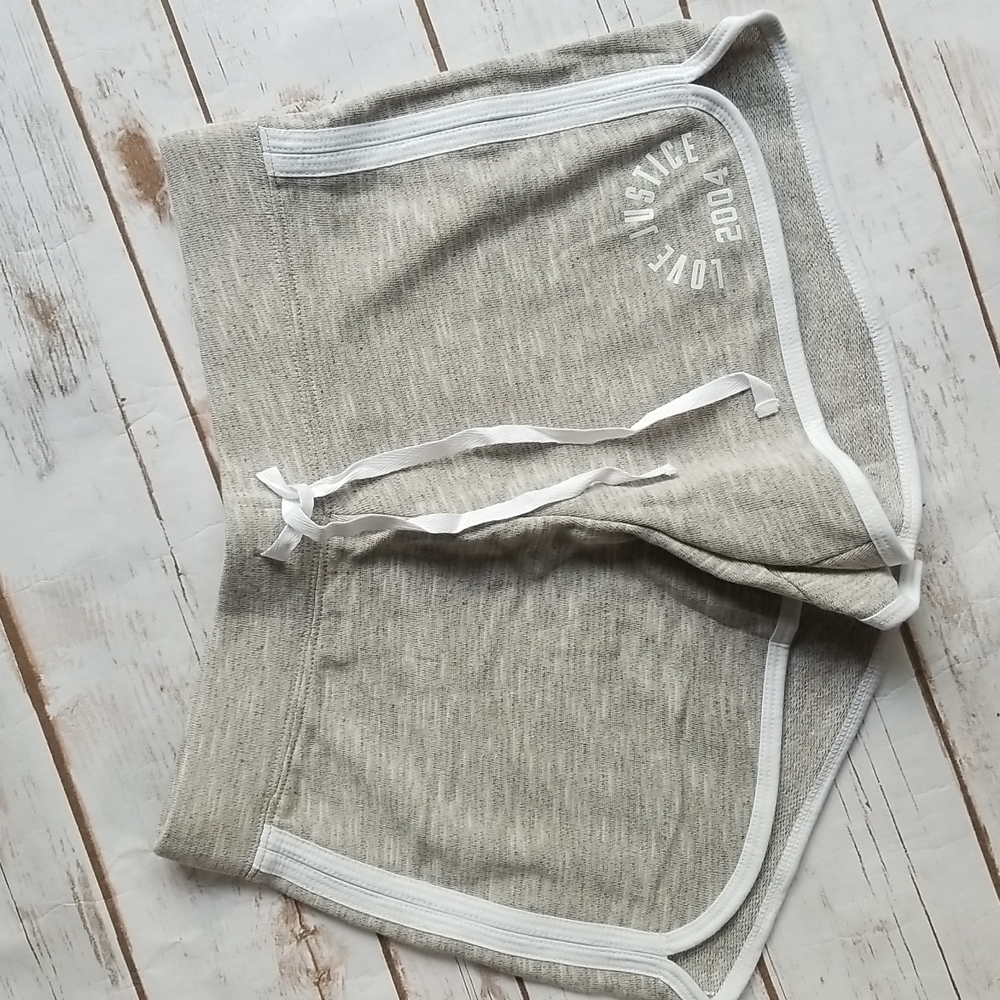 Justice dolphin shorts. NWT. Size 14 16